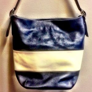 Large black and off white Coach tote purse.